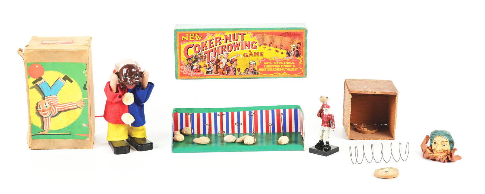 LOT OF 3: EUROPEAN CLOWN AND JACK BOX ITEMS.: Lot of three includes: a West German clown in box, holding mask over face; a Jack-in-the-box with a woman's head in composition, detached but present, and Jack box needing some fixing; and third is an