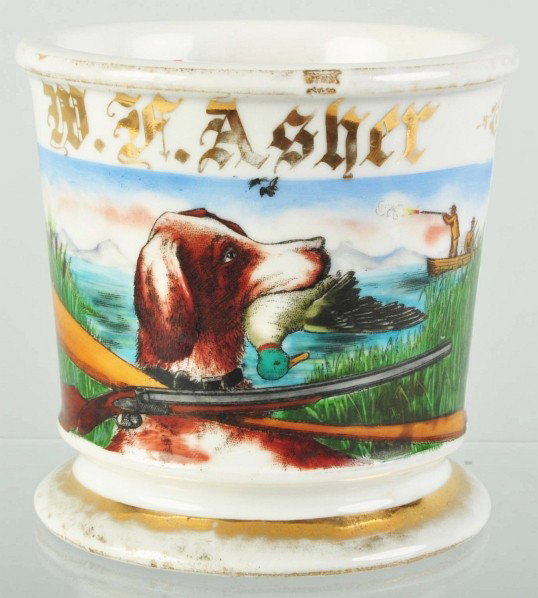 Hunting Dog with Duck in Mouth Shaving Mug.: Gilt name "W.F. Asher". Shows a boat with two duck hunters along with a hunting dog with duck in mouth, a shotgun, and a boat oar. Minor gold loss but no damage or repairs. Size: 3 - 5/8" T.