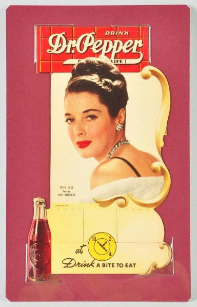 Cardboard Dr. Pepper Bottle Topper.: 1940s. Features Edith Luce. Clean and bright with no wear. Size: 8 - 1/4" T.