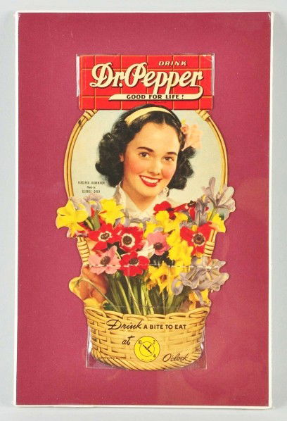 Cardboard Dr. Pepper Bottle Topper.: 1940s. Features Virginia Kavanagh. Only minor edge marks, one medium bend, a few small spots, and little to no wear. Size: 9" T.