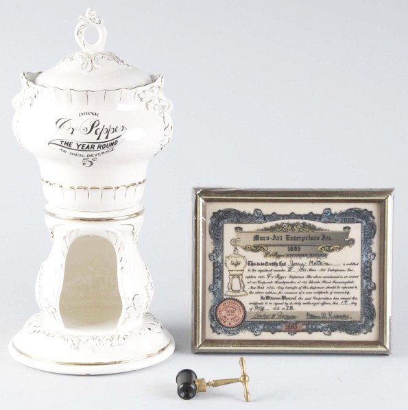 Dr. Pepper Marv-Art Reproduction Dispenser.: 1970s. Ceramic. Includes base bowl lid, plastic engraved certificate plaque, and reproduction spigot. Very clean overall with no wear. Size: 19 - 1/4" T.