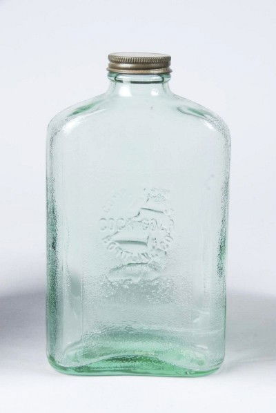 Coca-Cola Bottling Company Water Bottle.: Circa 1930s to 1940s. Embossed on both sides. One side features a sailing ship in ocean and the other side the Coke logo. Clean and bright with only a few small interior stain lines. Size: 8 - 3/4" T.