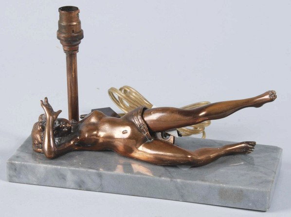 Figural Nude Cigar Cutter on Marble Base.: Circa 1920s. Cigar cutter on marble base with lamp. Appears to have European wiring. One small flake to right corner. Nice detail. Size: 8 - 1/2" L.