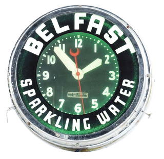 WORKING BELFAST SPARKLING WATER ADVERTISING CLOCK.: Early Belfast Sparkling Water clock with label that reads "Glo-Dial Clock Co. / Los Angeles, Calif.". Canadian and US patents are present. Overall scattered wear on outer ring of chrome part of clock,