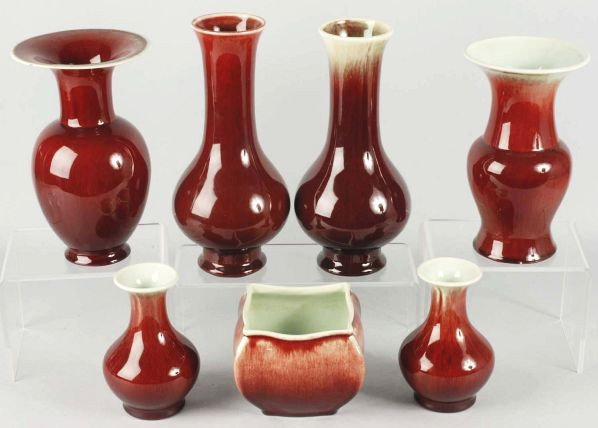 Lot of 7: Catalina & Gladding McBean Pieces.: All in oxblood over light turquoise to white glaze. Includes one squared off bowl form planter, one with Davison-Paxon & Co. store label, two pieces ink stamped "Made in USA", and other items. Large f