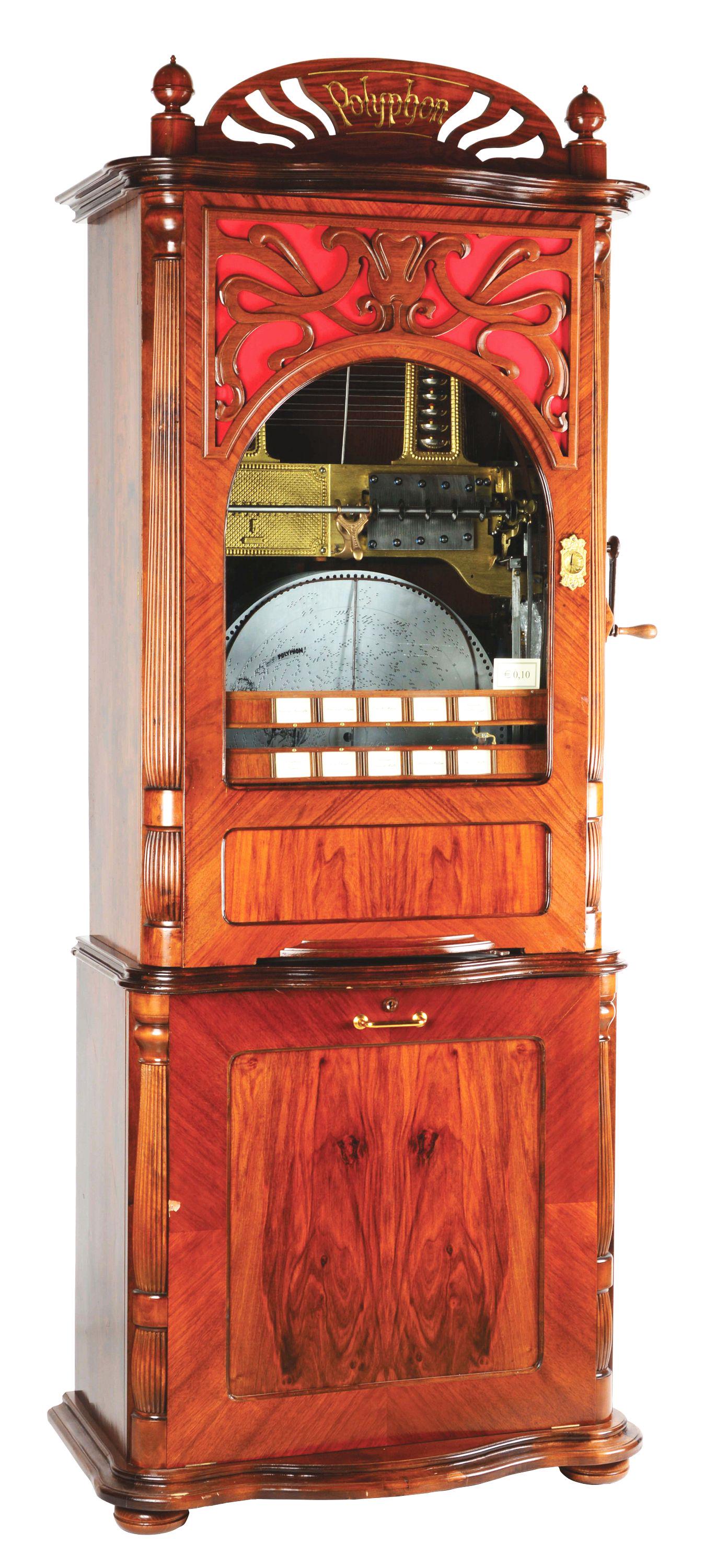 POLYPHON STYLE #5 AUTOMATIC CHANGER DISC MUSIC BOX WITH ORIGINAL STAND.: 1900, GERMANY: The Polyphon style #5 comes with an automatic changer, saucer style bells, and an original base with storage. Playing 56cm (22 - 1/2") discs across 118 teeth and 16 bells on a duplex co
