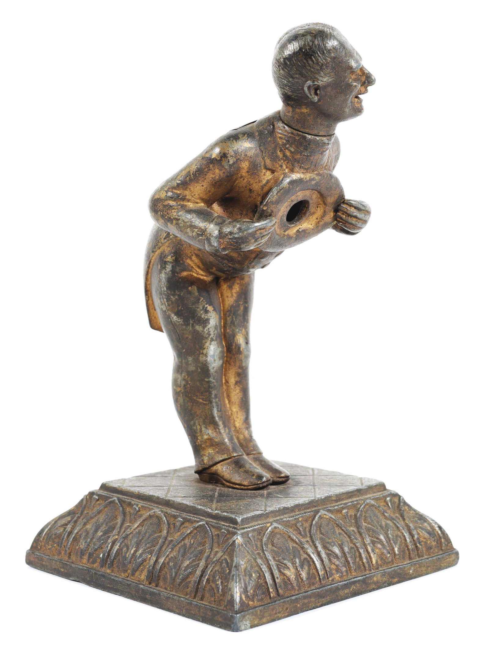 FIGURAL BOWING GENTLEMAN CIGAR CUTTER.: This is a cast iron figural cigar cutter showing a bowing man holding his hat to the chest. There is a hole in his hat where the cigar is placed. His head turns to nip the cigar. CONSIDERATIONS: Shows