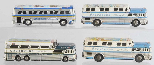 Lot of 4: Tin Greyhound Bus Friction Toys.: Japanese. Working. Scarce variations with scenic lithograph on roofs. Two marked "Made in Japan" and two marked "KTS". One marked "New York" with picture of Statue of Liberty, one marked "Seattle" wit
