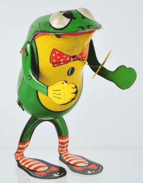 Tin Litho Frog Wind-Up Toy.: German. Made by CKO Kellerman. Working. Marked "Made in Germany" on back of toy. Original tongue and bee that is attached to toy with wire. When in operation, wire with bee moves back and forth while