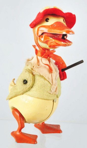 Scarce Schuco Mother Goose Wind-Up Toy.: German. Pre-war. Felt-covered tin. Marked "Schuco" on sides. Holds cane in left hand. When in operation, mouth opens and closes and bellows in mouth makes a squeaking noise. Some fading to clothing. V