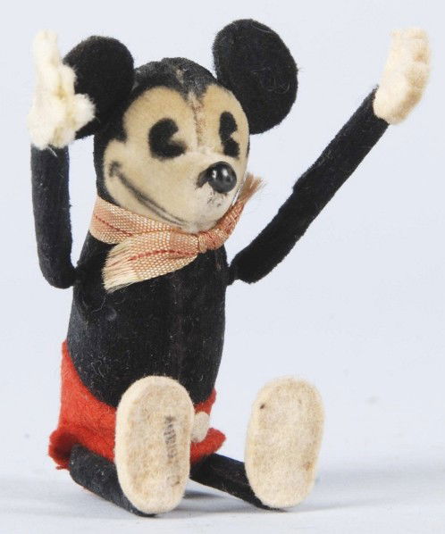 Felt-Covered Disney Schuco Somersault Mickey Toy.: German. Working. Very scarce. Original felt ears. When wound, arms move and Mickey somersaults. Legs are also movable but only the arms are controlled by motor. Very little wear overall. Size: 4" T.