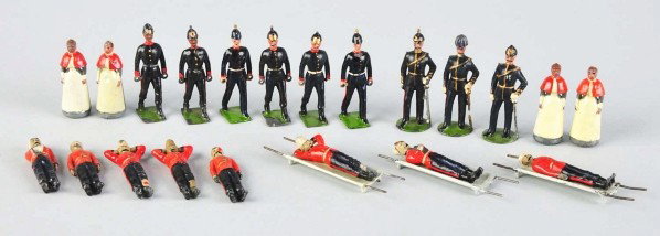 Early Set of 21 Metal Britains Soldiers.: Includes English military figures, nurses, and three stretchers with wounded men. Two figures with helmets broken off and missing. Some chipping and wear overall. Comes with box that is not original t