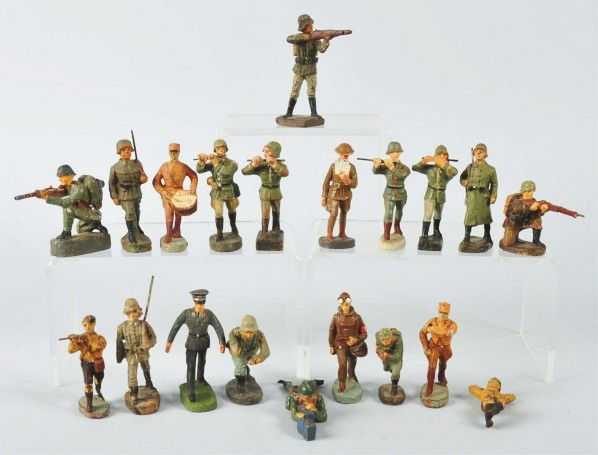 Lot of 20: Elastolin German Toy Soldiers.: Circa 1930s and 1950s. Made in Germany. Pre and post-war production. Includes rare Hitler youth, Italian WWII cap-shooter, SA pilot, German army fifers and other Nazi figures, few are Schusso or Duro.