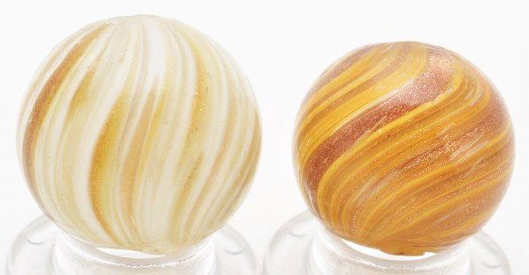 Lot of 2: Lutz Marbles.: The larger marble is a white onionskin Lutz and the smaller marble is a yellow onionskin Lutz. Size: 5/8" & 11/16" Dia.