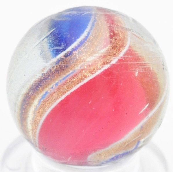 Ribbon Lutz Marble.: Blue and red ribbon Lutz. Lutz bands accented with white. One minor flea bite. Size: 21/32" Dia.
