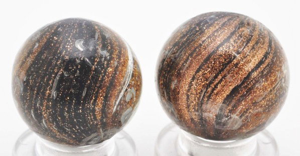 Lot of 2: Black Glass Lutz Marbles.: Two black glass Lutz marbles, both loaded with Lutz. Both marbles also have several surface moons. Size: Each: 3/4" Dia.