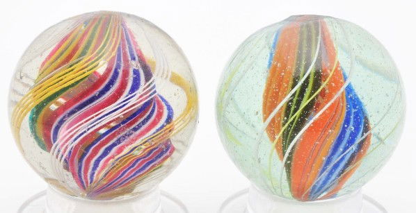 Lot of 2: Divided Core Swirl Marbles.: Includes one multicolor core with sets of outer white and yellow latticino and one with bright English color core of orange, yellow, baby blue, white, olive green, and lime green. Size: Both: 1 - 9/16