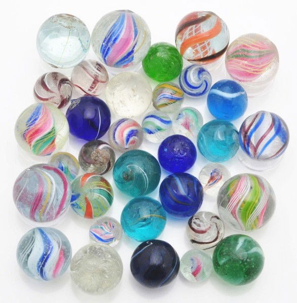 Lot of 35: Handmade Marbles.: Includes latticino, solid, and divided core swirls. Also includes micas, clearies, coreless color swirls, and pewee swirls. Size: Range: 7/16" to 13/16" Dia. CORRECTION - New Estimate $250 - $500.