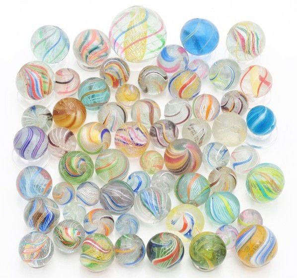 Lot of 62: Assorted Swirl Marbles.: This lot includes various latticinos, solid cores, divided cores, and coreless swirls. Size: Range: 7/16" to 1 - 1/8" Dia.