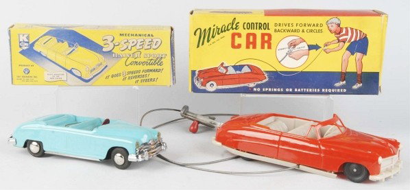 Lot of 2: Plastic Automobile Toys.: American. Includes one wind-up Toy Founders Kaiser and one remote control California Molders Miracle car with some warping on bottom. Includes both original boxes. Size: Largest: 12" L.