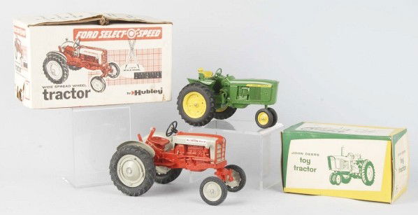 Lot of 2: Diecast Tractor Toys.: Includes one Hubley Ford Select-O-Speed and one John Deere. Very little wear overall. Includes both original boxes, one with insert. Size: Largest: 11 - 1/2" L.
