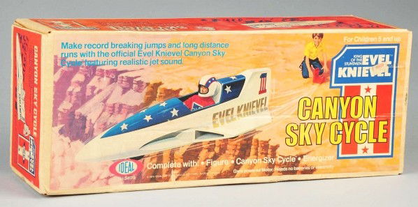 Ideal Evel Knievel Canyon Sky Cycle Toy.: Sealed in original box marked "1974" with original price sticker. Box has some fading throughout. Unused condition. Old store stock. Size: Box: 7" x 18" x 5 - 1/2".