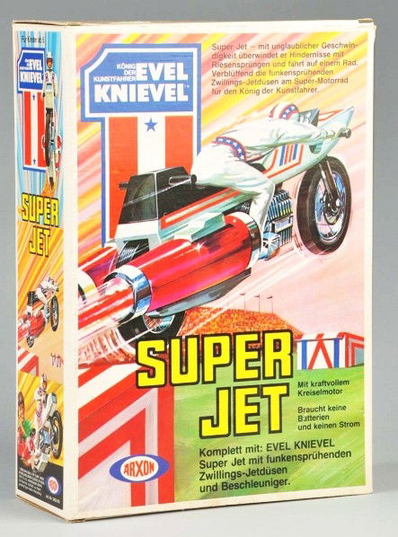 Evel Knievel Super Jet Motorcycle Toy.: European variation made by Arxon. Includes original box marked "1976 Ideal Toy Corp." and insert. Unused condition. Old store stock. Size: Box: 14 - 1/2" x 10 - 1/4" x 4 - 1/2".