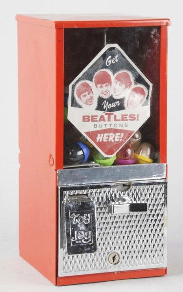 Beatles Coin-Operated Button Vending Machine.: Full of prizes that may or may not be original buttons. Size: 14" T.