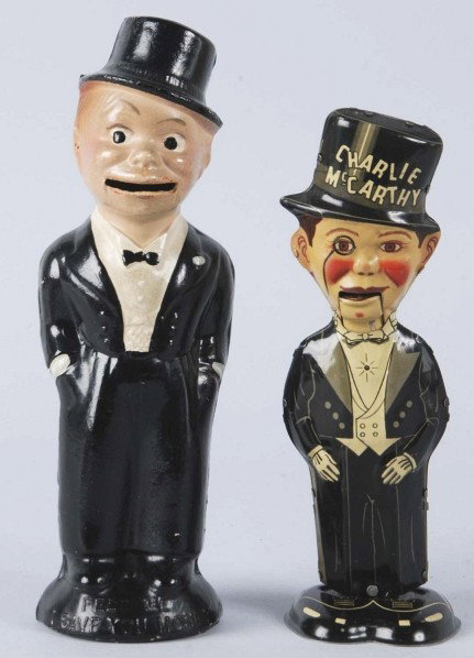 Lot of 2: Charlie McCarthy Toy Items.: Includes one Marx tin wind-up waddler toy and one composition still bank with original trap. Very little wear throughout. Size: Largest: 9 - 1/2" T.