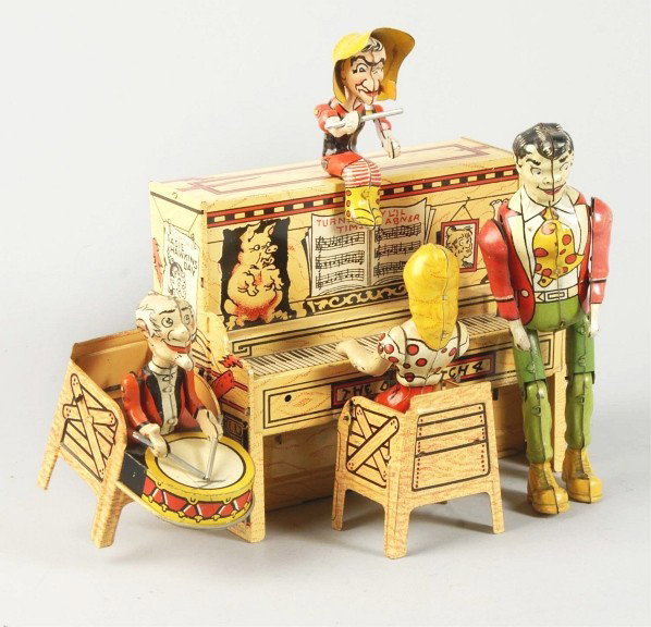Tin Unique Art L'il Abner Band Wind-Up Toy.: American. Working. Marked "The Dog Patch 4" and "Turnip Time" on piano. All original parts including drumsticks. Some scratching and wear overall. Size: 8 - 1/2" T.
