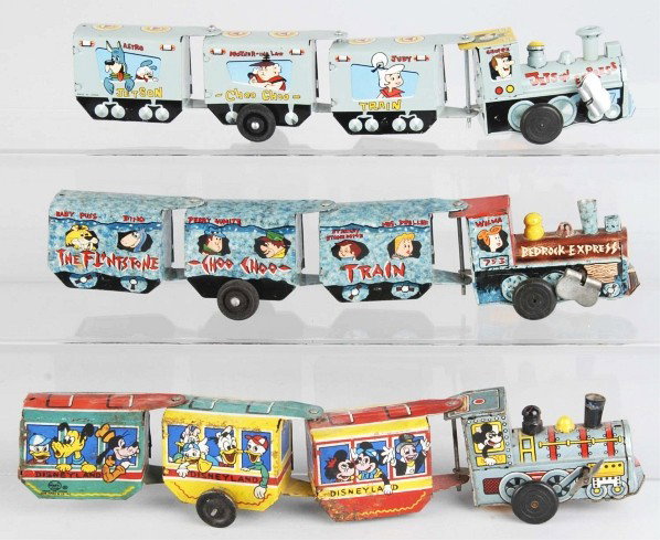 Lot of 3: Tin Marx Character Train Wind-Up Toys.: American. Working. Includes Flintstone Bedrock Express, Disneyland, and Jetson Express. Size: Each: 12 - 1/2" L.