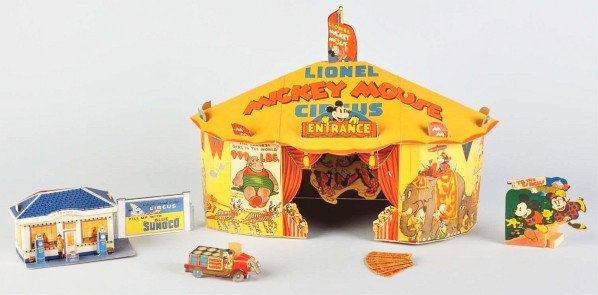 Tin Lionel Disney Mickey Circus Train Wind-Up Toy: American. Working. Complete train includes wind-up Lionel Lines locomotive, Mickey Mouse stoker tender, three lithographed passenger cars, and all original cardboard pieces. Also includes composition 