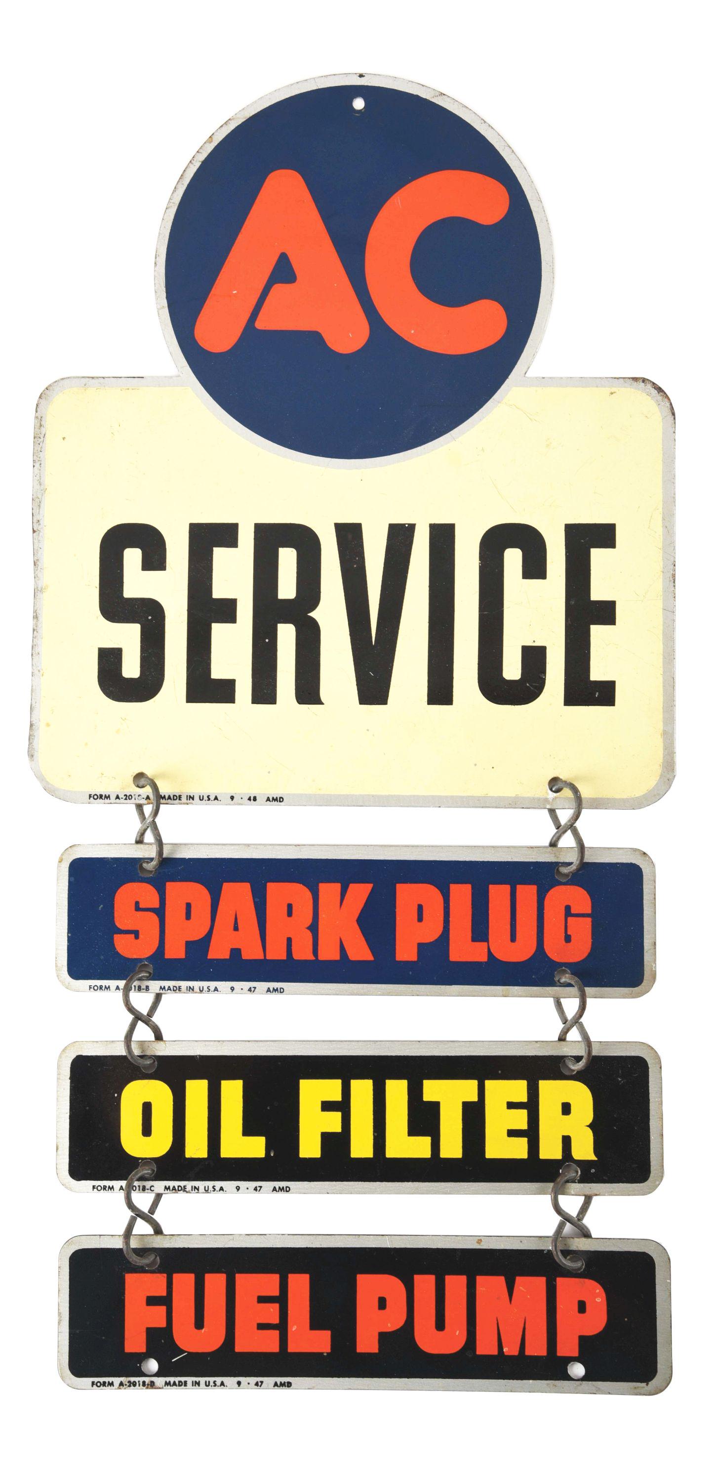 AC SPARK PLUG, OIL FILTER & FUEL PUMP SERVICE THREE TIER TIN SERVICE STATION SIGN. (1 of 3)