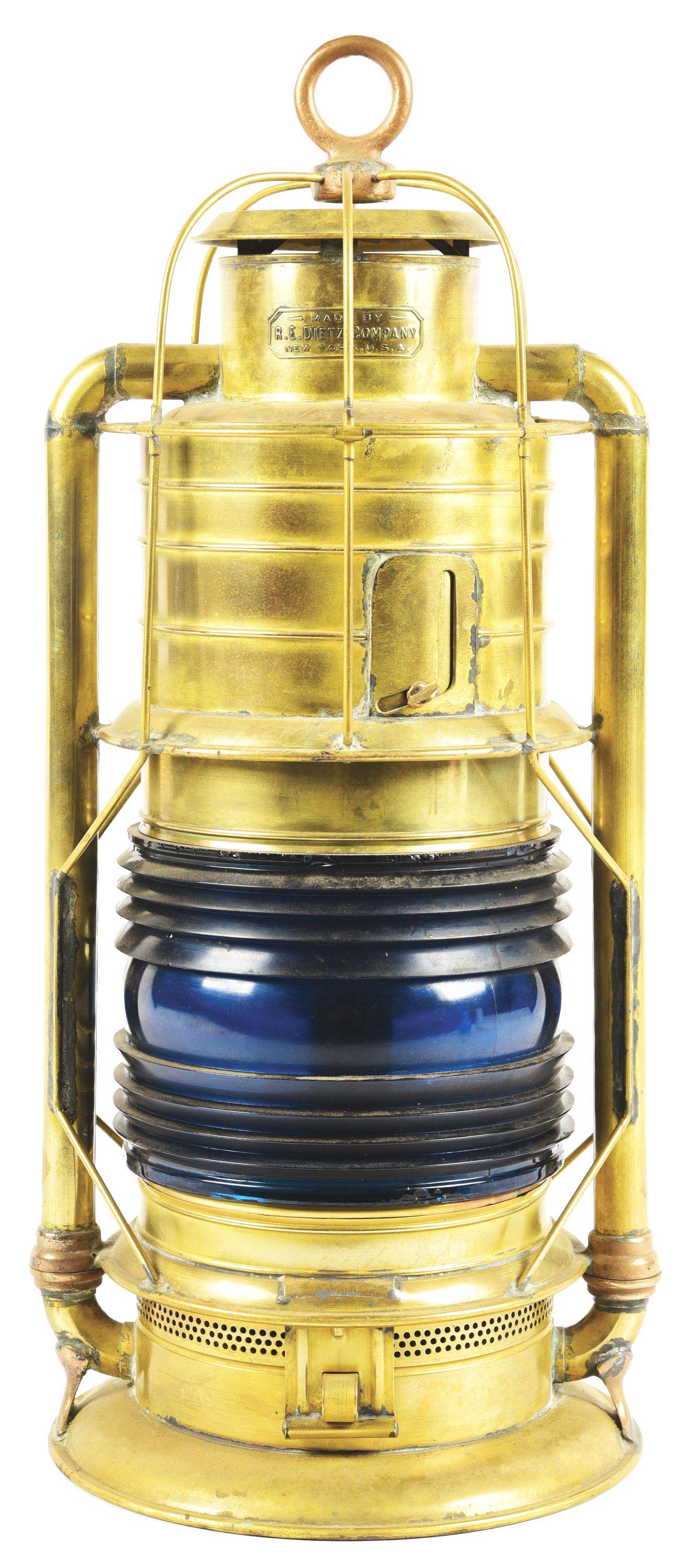 BRASS MARINE SIGNAL LAMP.: A large, cold blast Dietz signal lamp, embossed in the chimney "Made by R. E. Dietz Company, New York, USA". Lamp has a 8" diameter signal green Fresnel lens that is 6" tall. Fount and burner are inta