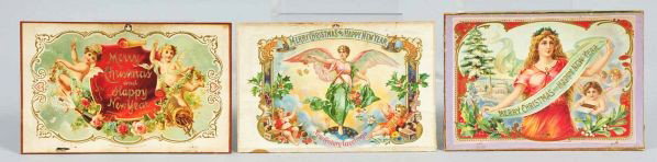 Lot of 3: Holiday Cigar Box Lids.: Description Lids only. All are rare. Includes Merry Christmas & Happy New Year with two cherubs, one with beautiful woman holding a banner that reads "Merry Christmas and Happy New Year" with children