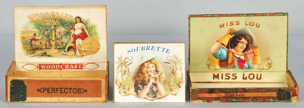 Lot of 3: Cowgirl & Western Cigar Boxes.: Description All are rare. Includes Miss Lou showing a cowgirl holding a whip, Soubrette (lid only) depicting a girl with hat smoking a cigar, and Woodcraft depicting two men cutting down a tree with b
