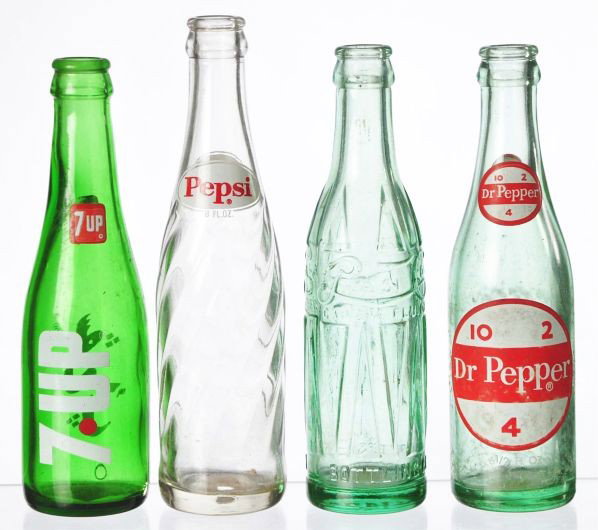 Lot of 4: Glass Soda Bottles.: Description Includes two Pepsi, one Dr. Pepper and one 7up. Light to medium overall wear and soiling. Condition (Very Good - Excellent). Size Largest: 8 - 3/4" T.