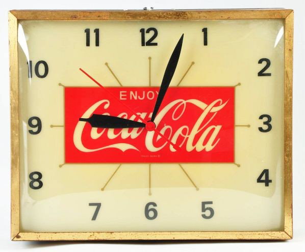 1960s Metal & Plastic Fluorescent Light-Up Clock.: Description Made by Swihart. Displays well. Only light wear, light surface rust on the outer gold front band, and minor soiling to top of face. Condition (Excellent). Size 16 - 1/4" x 13 - 1/4".