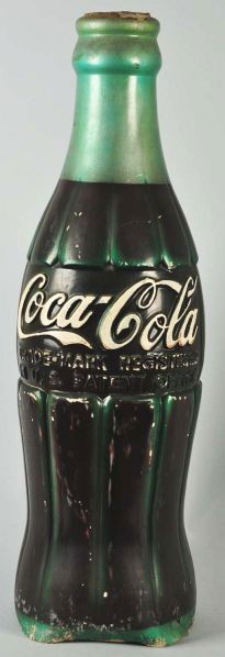 Embossed Rubber Coca-Cola Display Bottle.: Description 1950s. Missing the cap and some tears where part of the bottom lip is missing; otherwise, medium to heavier overall wear, marks, scratches, and paint chips. Condition (Fair). Size 41 - 1/2