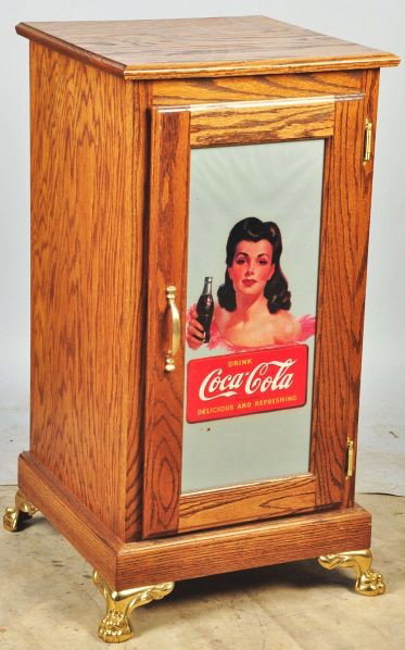 Oak Slot Machine Stand.: Description Metal feet and reverse on glass Coca-Cola label. Includes light inside for stand to be lit from behind. Condition (Excellent). Size 33 - 1/2" T.