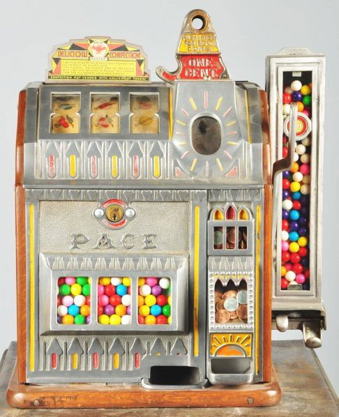 Pace Bantom 1¢ Gum Ball Slot Machine.: Description An unusual three wheeler with a gum ball side vendor, has fortune wheel, strips and gum ball. Displays with lithograph replacement. Condition (Very Good - Excellent). Size 20 - 1/2" T. CO