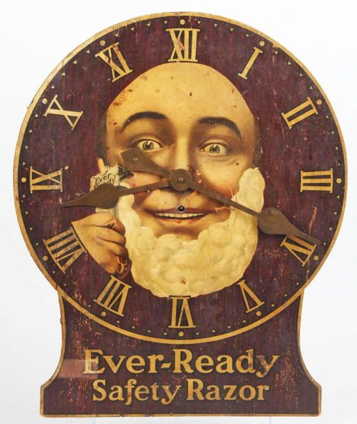 Wooden Ever Ready Safety Razor Clock.: Description Depicting a man shaving with Ever Ready shaver. Scuffs and marks to face and pendulum is not included. Condition (Good). Size 22" T.