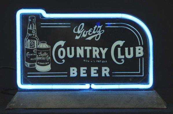 Goetz Country Club Bottle & Can Neon Sign.: Description 1930s to 1940s. MK Goetz, St. Joseph, MO (1859 to 1961). Blue neon border around a piece of etched glass mounted on a custom built metal can. Condition (Excellent). Size 18" L.