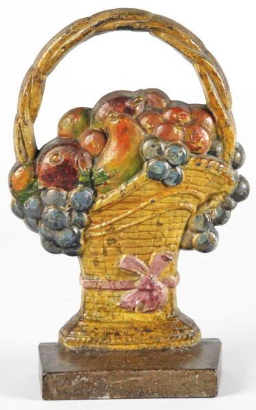 Cast Iron Fruit Basket Doorstop.: Description Made by Judd Company. Numbered "1252". Condition (Good). Size 9 - 1/2" T.