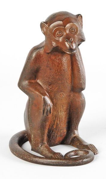 Cast Iron Monkey Doorstop.: Description Three piece casting, full-figure. Condition (Very Good). Size 9" T.