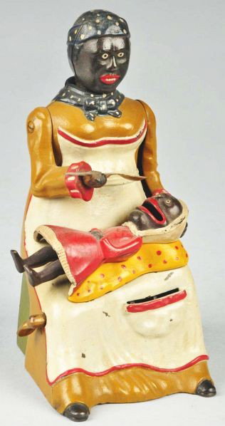Cast Iron Mammy with Spoon Mechanical Bank.: Description Yellow dress variation. Working. Manufactured by Kyser & Rex. Beautiful and professional restoration. Condition (Restored). Size 7 - 1/2" T.