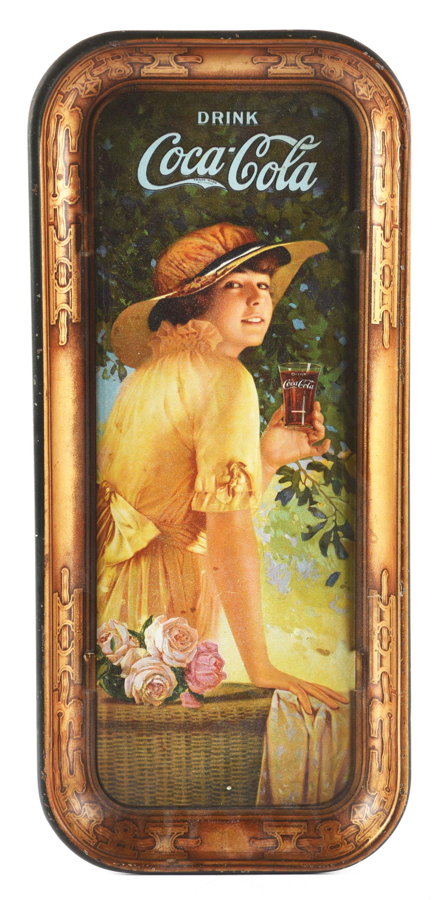 1916 COCA-COLA ELAINE TRAY.: This 1916 long version Coca-Cola Elaine tray shows light foxing to the main playfield, areas of paint loss, scuffs and abrasions to the outside rim. Condition: (7.5). Dimensions: 8 - 1/2" x 19".