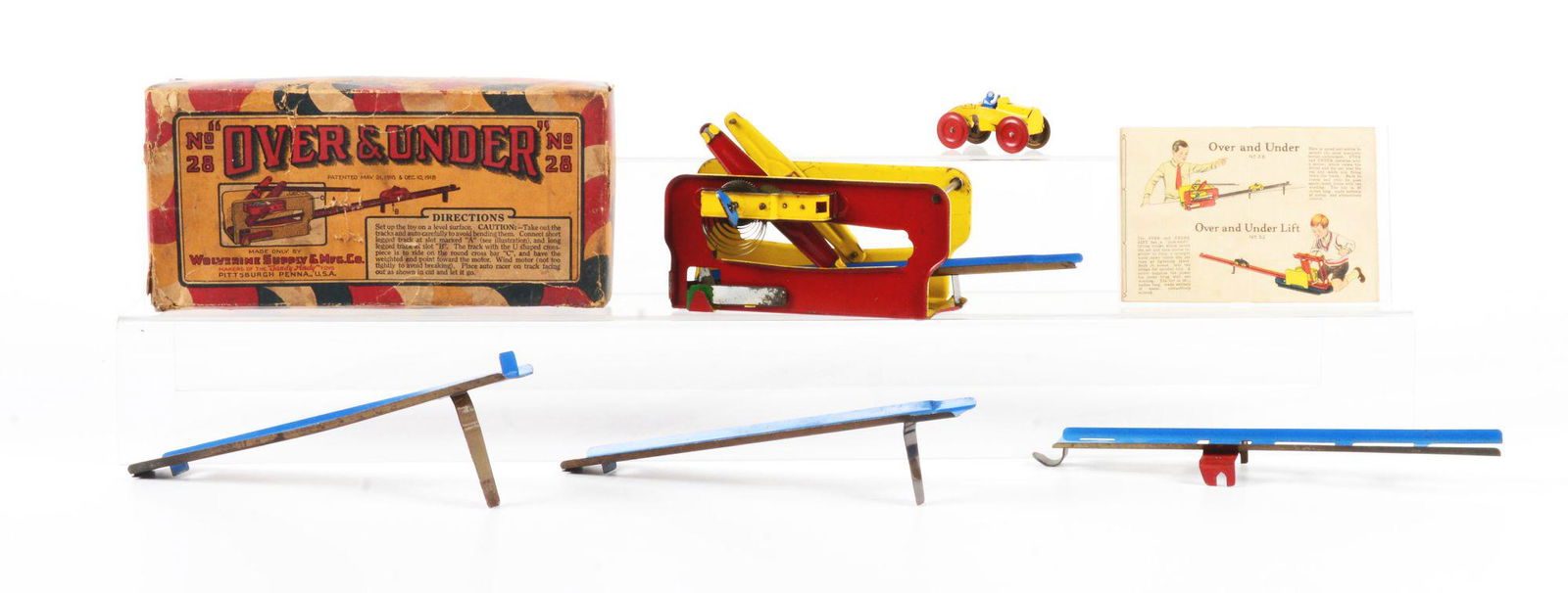 WOLVERINE PRESSED STEEL WIND-UP OVER AND UNDER TOY. (1 of 2)