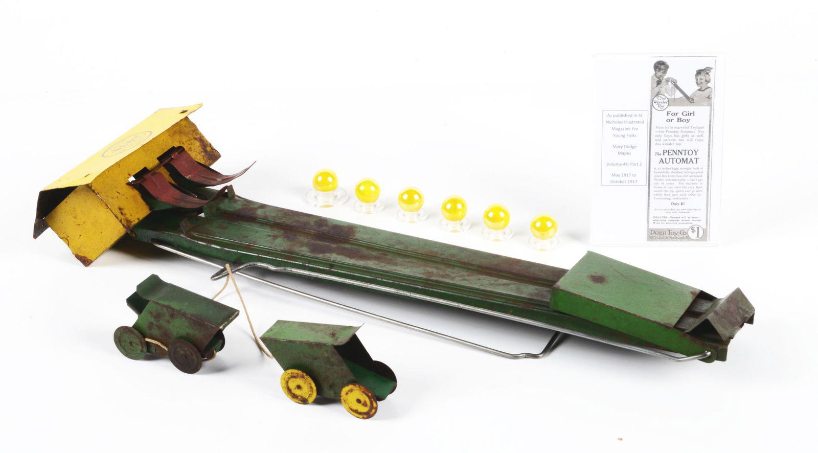 VERY EARLY AND SCARCE PENNTOY AUTOMAT.: WWI era toy comes with original cart and bag of marbles. Marked "Patented 1916 Penntoy Company, Pittsburgh, PA". Comes with laser printed advertisement, showing the toy cost $1. Toy is complete but do