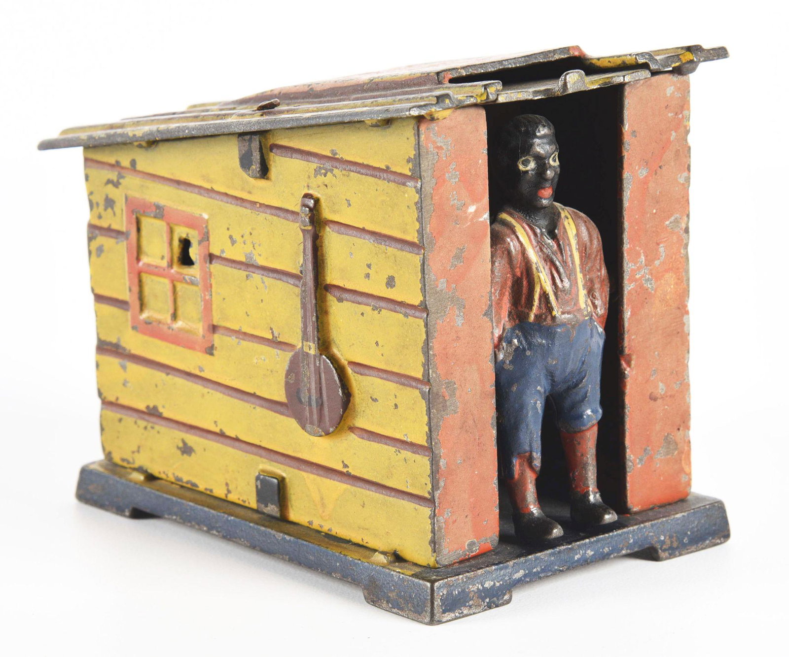 CAST IRON CABIN BANK.: Yellow variation. Manufactured by J. & E. Stevens. Condition: (Very Good). Dimensions: 4 - 1/4" x 3" x 3 - 1/2".